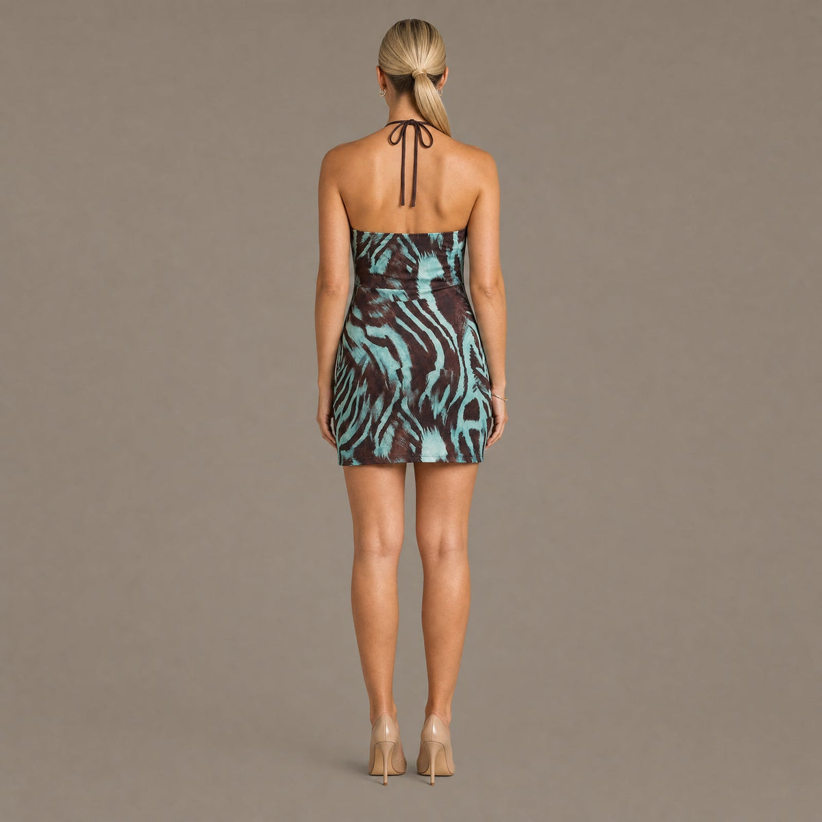 Back view of the brown zebra print halter bodycon dress
