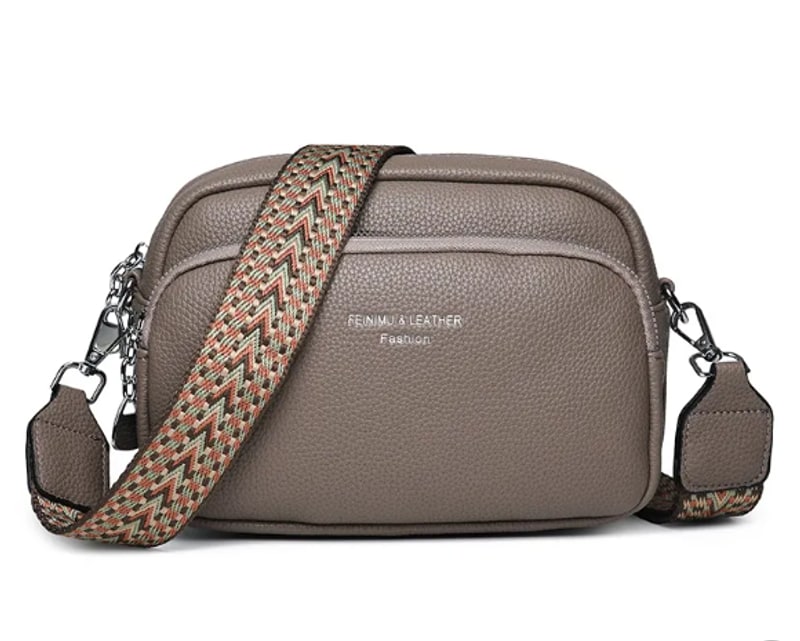 Taupe crossbody bag with wide woven strap and front zip pocket