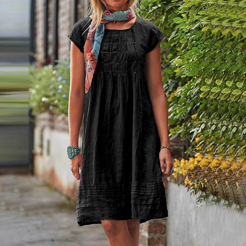 Black loose summer dress with pintuck bodice and short sleeves
