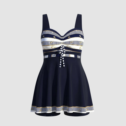 Navy blue swim dress with striped sweetheart bodice laid flat