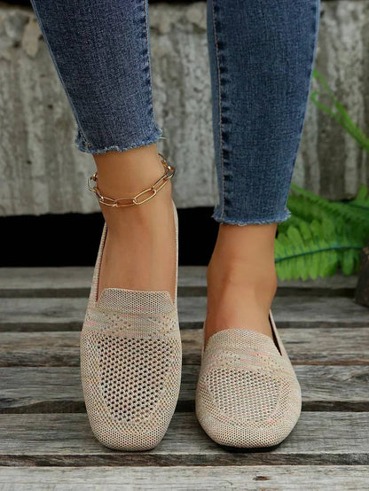 Beige knit square toe slip on flats worn with jeans