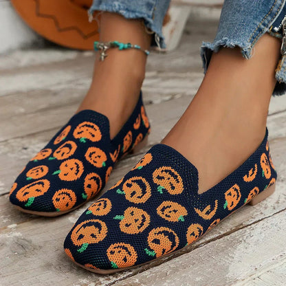 Navy knit slip on flats with orange pumpkin print
