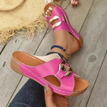 Pink orthopedic wedge slide sandal with gold chain detail