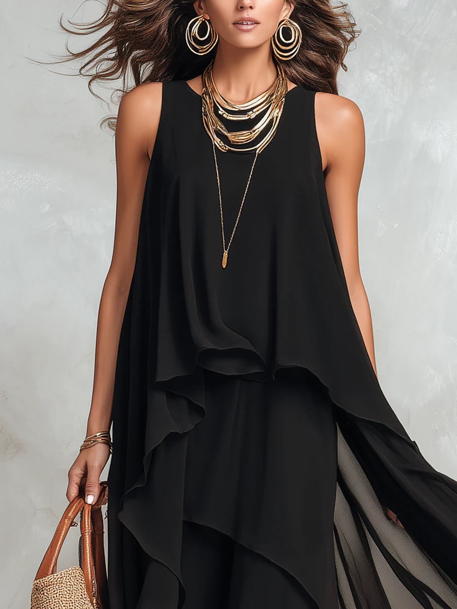 Black layered sleeveless maxi dress, front view showing the round neck and soft draped layers