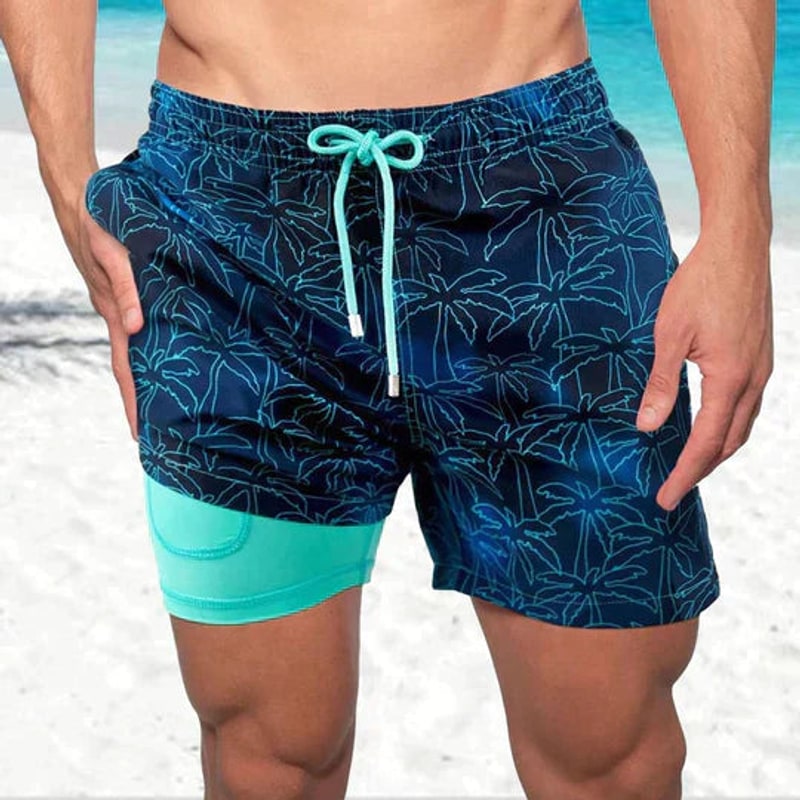 Navy blue palm print swim shorts for men with turquoise inner liner