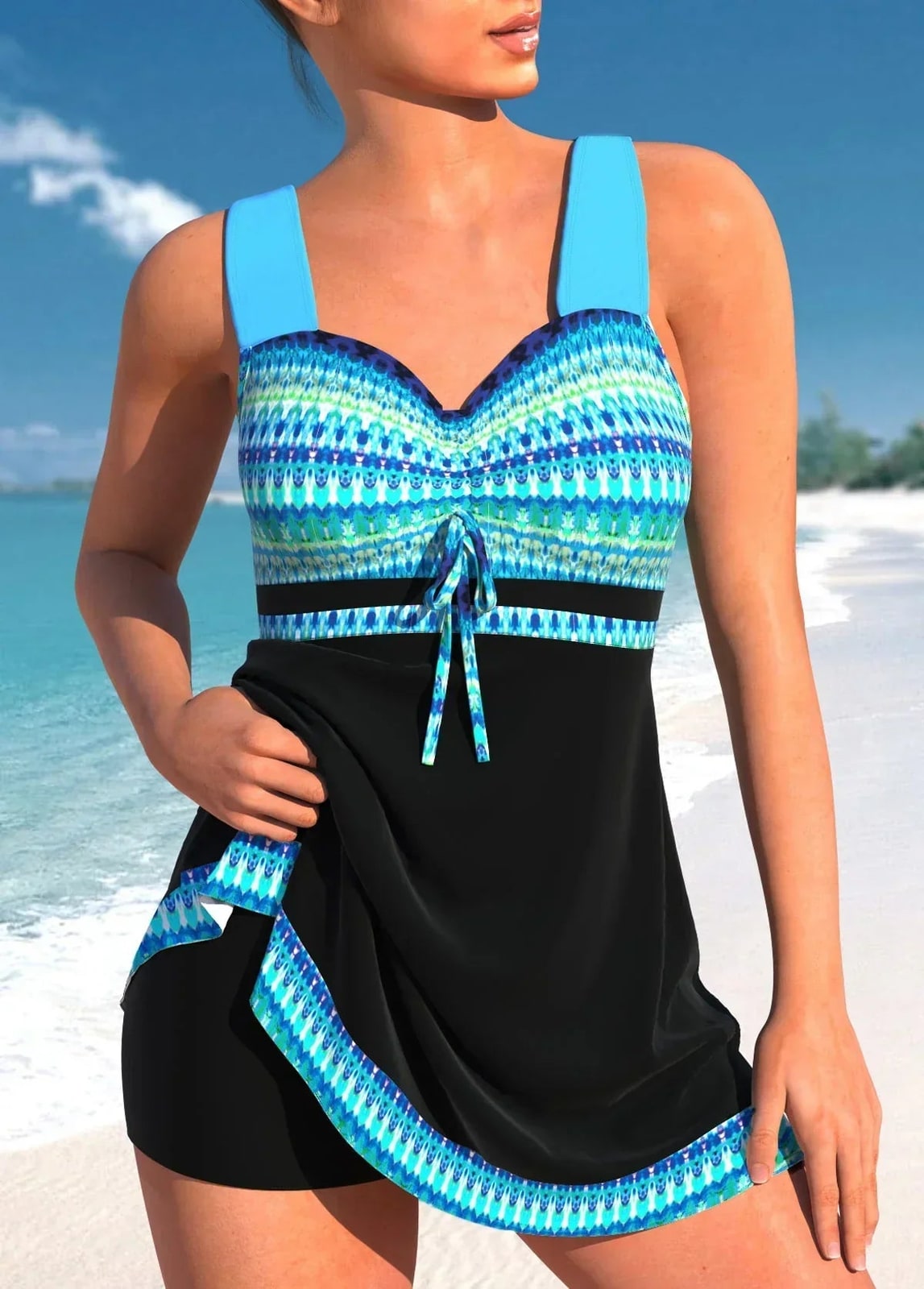 Black swim dress with turquoise printed top and sweetheart neckline