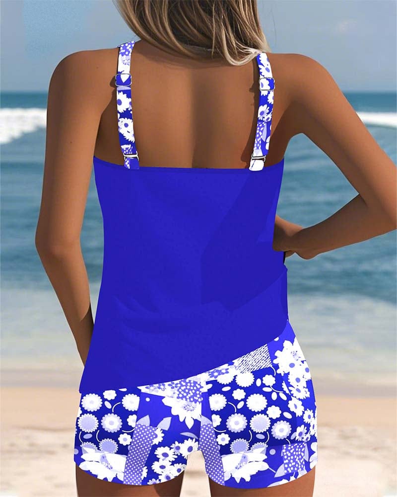 Back view of blue racerback tank top and floral swim shorts
