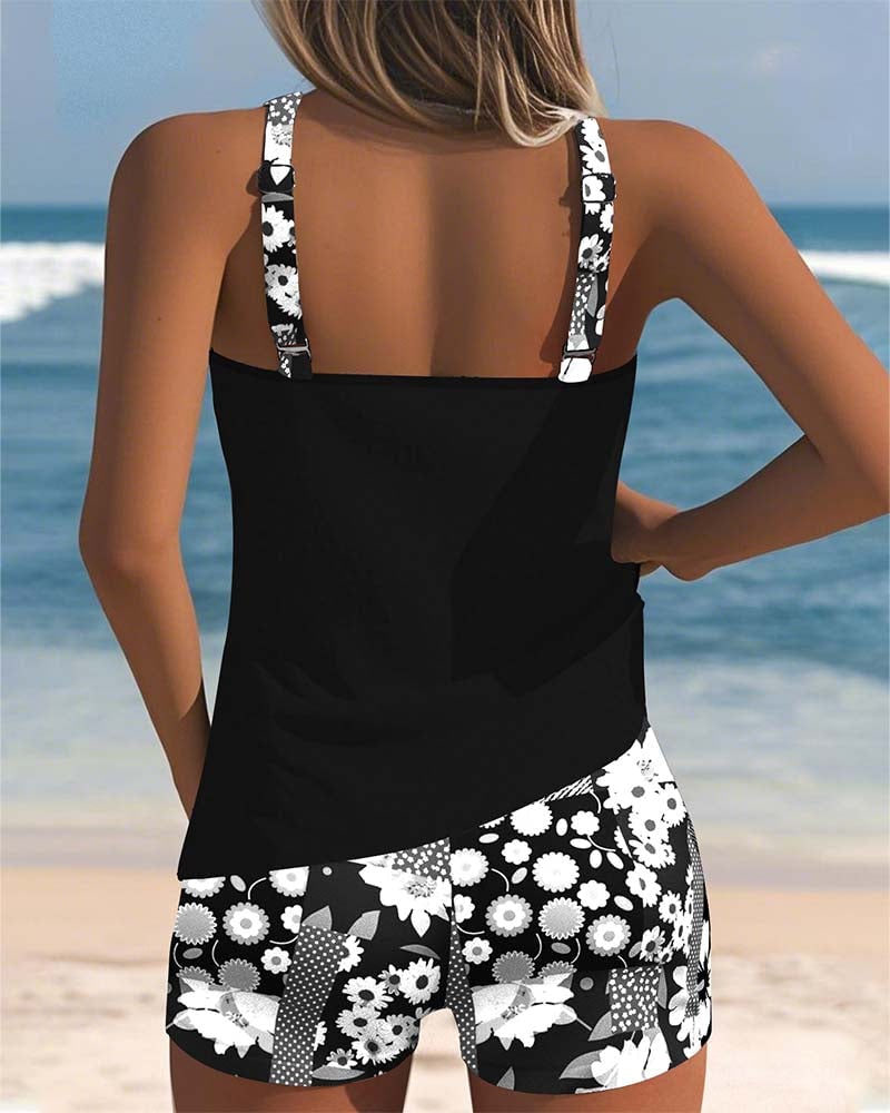 Back view of black racerback tank top and floral swim shorts