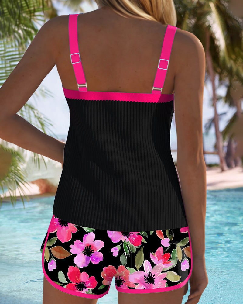 Back view of tankini top with fuchsia straps and floral swim shorts