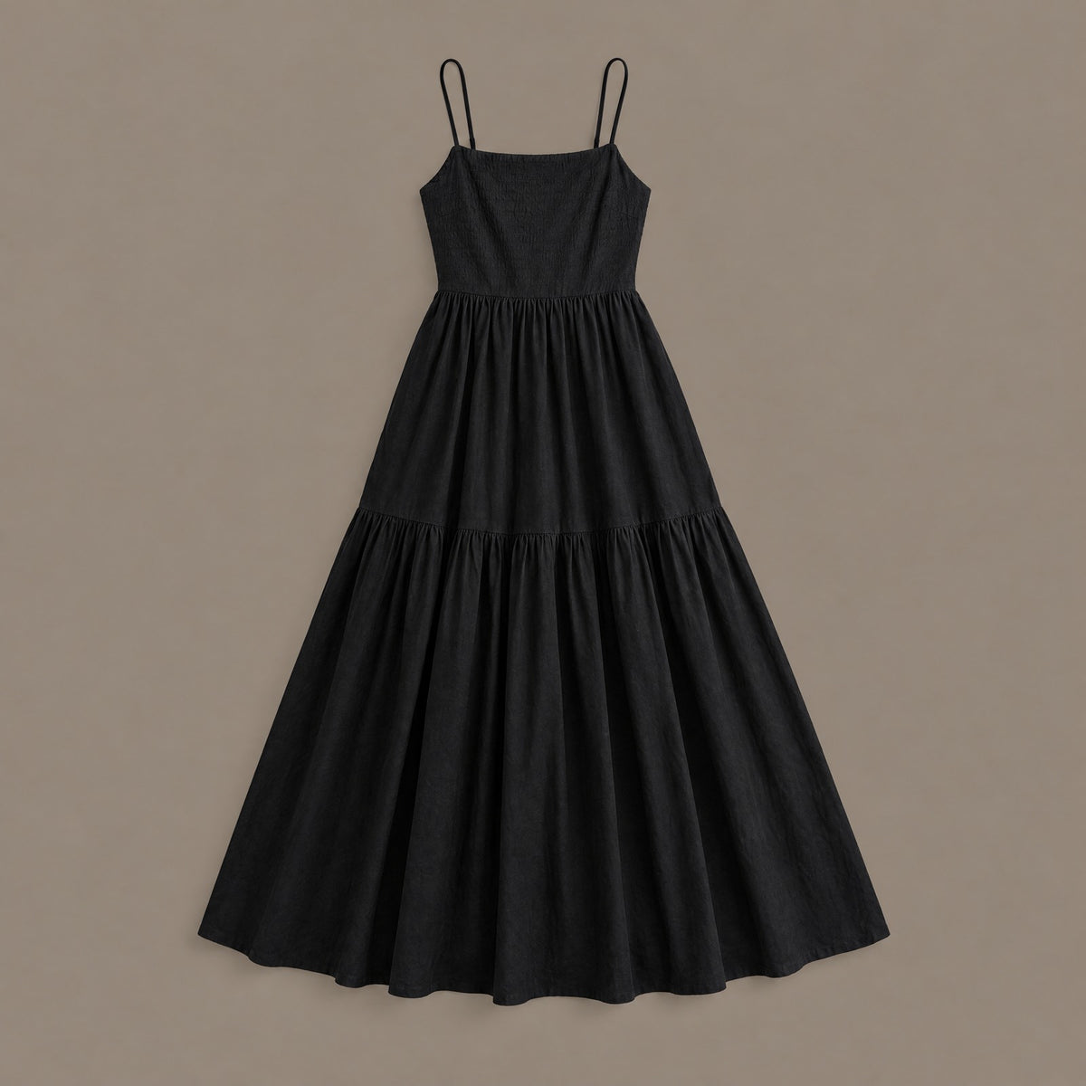 The black tiered maxi dress photographed on its own