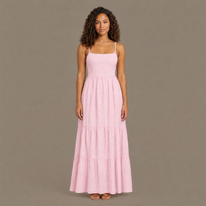 Woman wearing the pink backless tiered maxi dress, front view