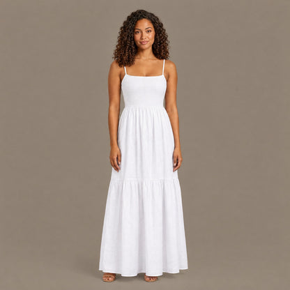 Woman wearing the white backless tiered maxi dress, front view