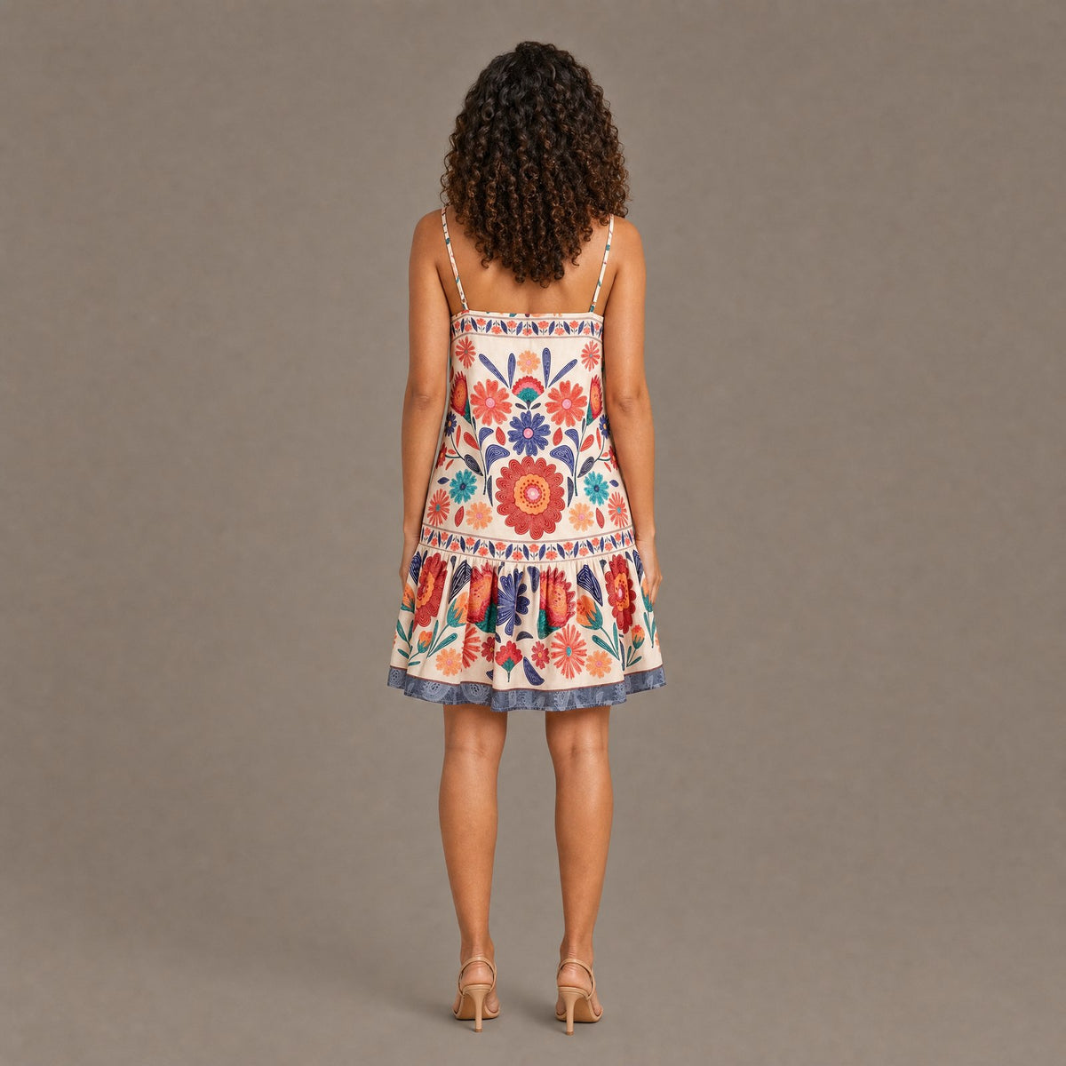 Back view of the orange bloom print spaghetti strap dress
