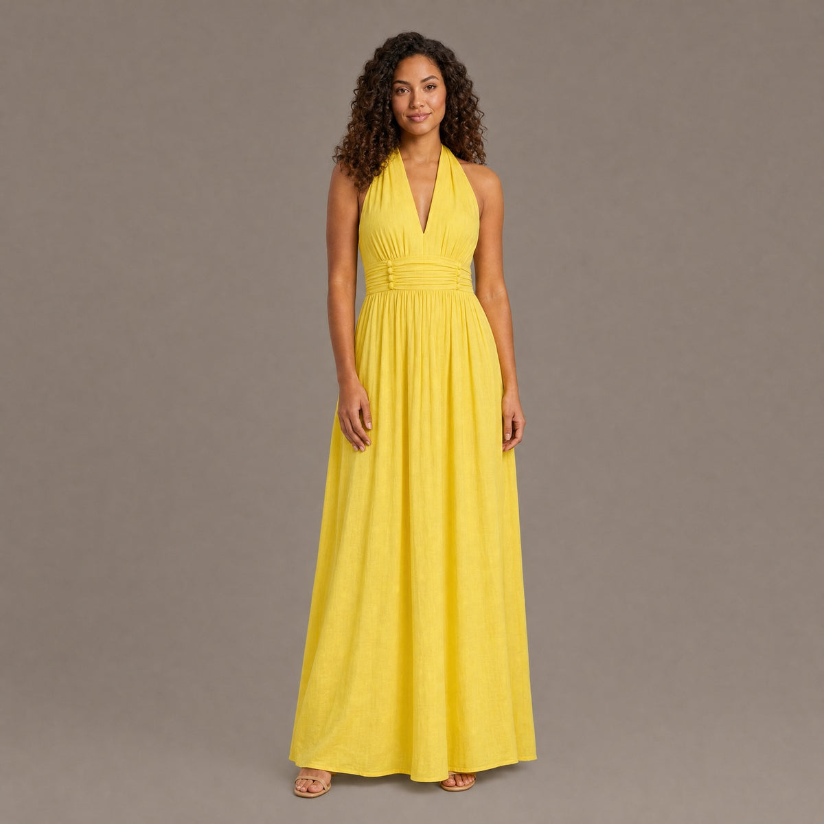 Woman wearing the yellow boho cotton linen halter maxi dress, front view