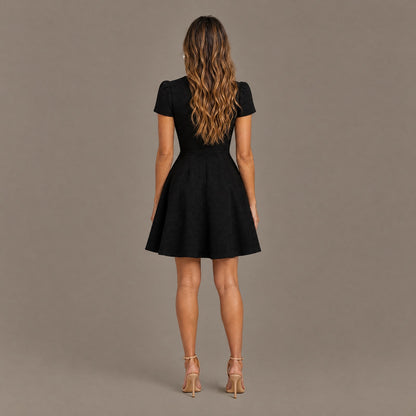 Back view of the black high neck fit and flare dress