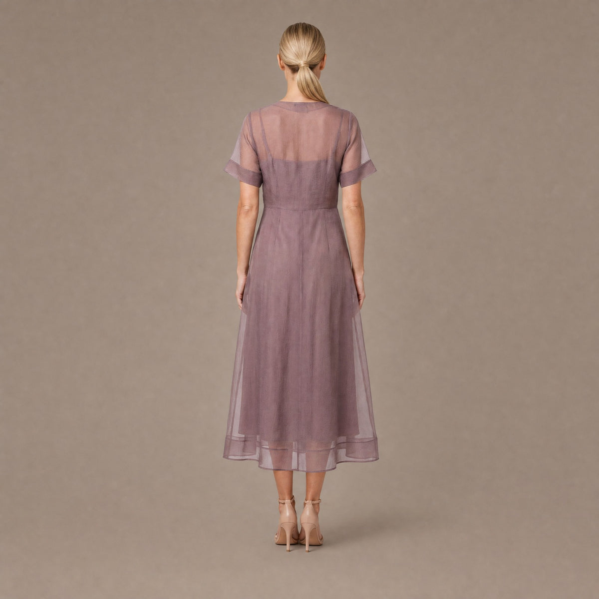Back view of the mink organza A-line button front midi dress