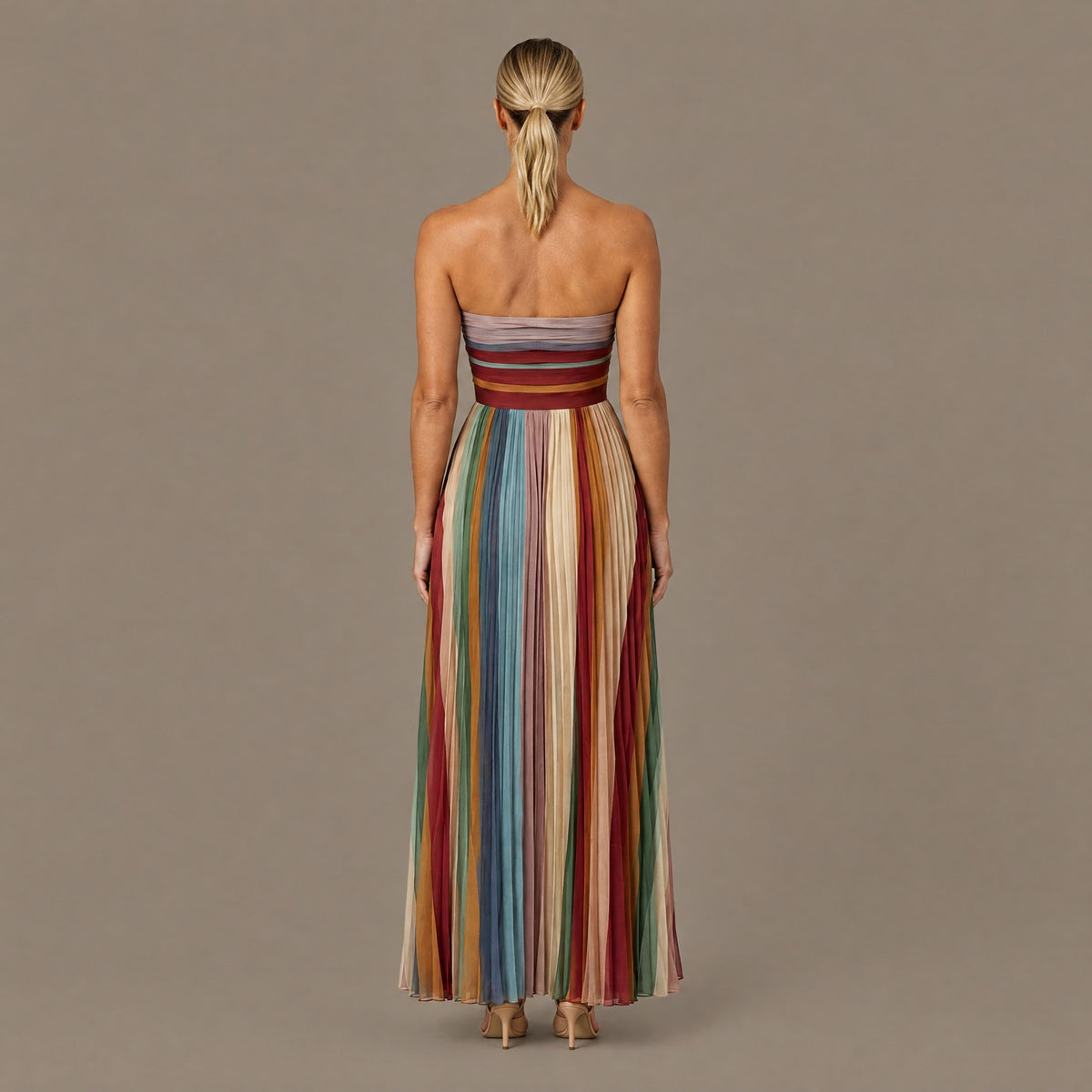 Back view of the pleated striped strapless maxi dress
