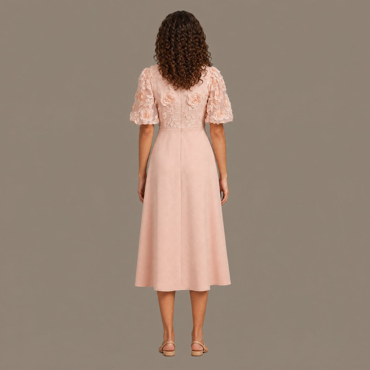 Back view of the peach pink puff sleeve floral midi dress
