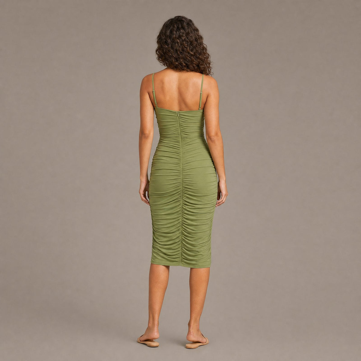 Back view of the green ruched bodycon dress