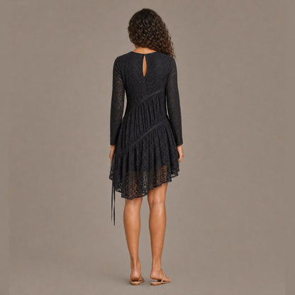 Back view of the coal black ruched tiered lace midi dress